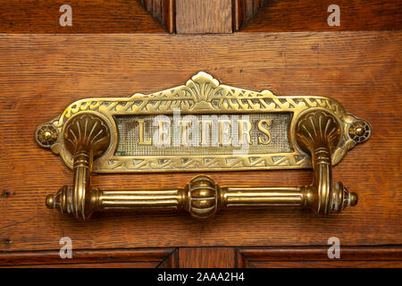 Close up of an old letterbox on an old wooden Stock Photo