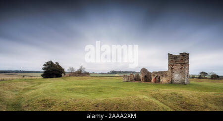 The ruined medieval Knowlton Church and earthworks is at the centre of a Neolithic ritual henge earthwork. Reputedly the most haunted place in Dorset. Stock Photo