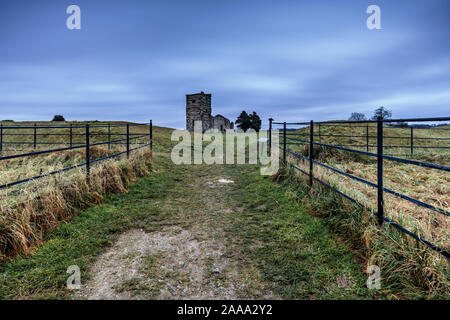 The ruined medieval Knowlton Church and earthworks is at the centre of a Neolithic ritual henge earthwork. Reputedly the most haunted place in Dorset. Stock Photo