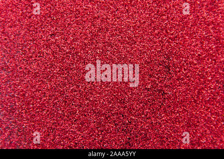 Bright crimson, red background with glitter. Can be used as