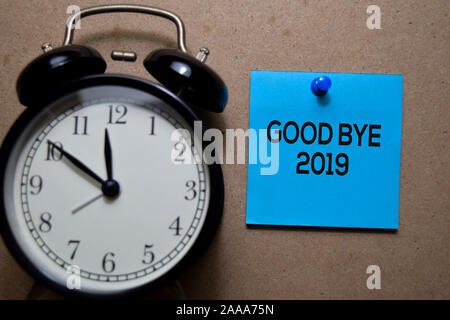 Good Bye 2019 write on sticky note. Isolated on Wooden Table Stock Photo
