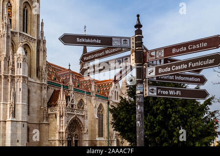 Direction signpost in front of Matthias Church. Stock Photo