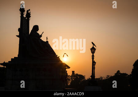 Sun sets over the Queen Victoria monument at Victoria Park, Kolkata the capital of West Bengal, India Stock Photo