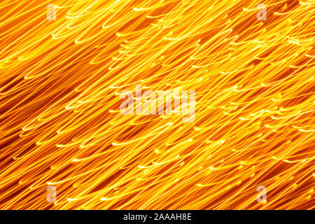 Futuristic blurred lights holiday monochrome background in yellow. Horizontal, soft focus Stock Photo