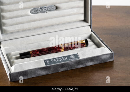 Morgantown, WV - 20 November 2019: Box holding an expensive Parker Duofold gold fountain pen in maroon Stock Photo