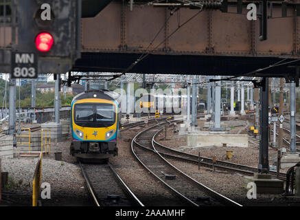 First Transpennine express class 185 and Northern Rail class 150 trains passing outside Manchester Victoria station Stock Photo