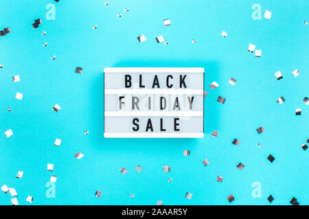 Light board with text Black Friday Sale on blue background. Stock Photo