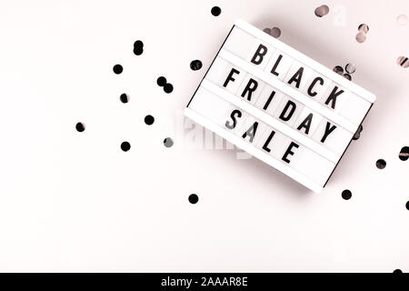 Light board with text Black Friday Sale on grey background. Stock Photo