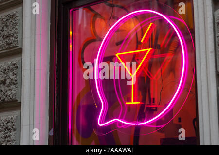 neon cocktail sign on the bar nightclub window. illuminated design Stock Photo