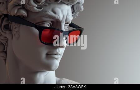 Bust of David with red glass glasses. Stock Photo