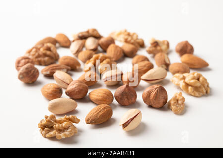 Mixed nuts on a white surface Stock Photo