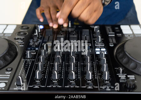 Dj mixes the track in the nightclub at party Stock Photo