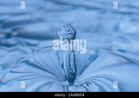 Water drop collision form metallic background Stock Photo