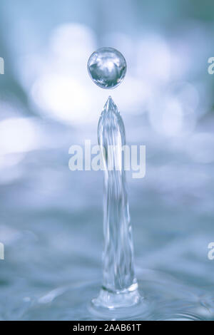 Water drop collision form metallic background Stock Photo