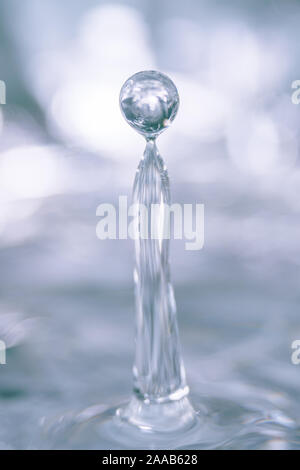 Water drop collision form metallic background Stock Photo