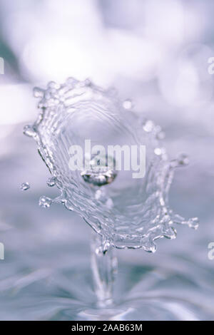 Water drop collision form metallic background Stock Photo