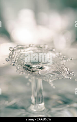 Water drop collision form metallic background Stock Photo