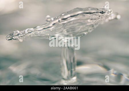 Water drop collision form metallic background Stock Photo