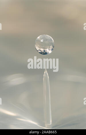 Water drop collision form metallic background Stock Photo