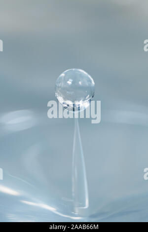 Water drop collision form metallic background Stock Photo