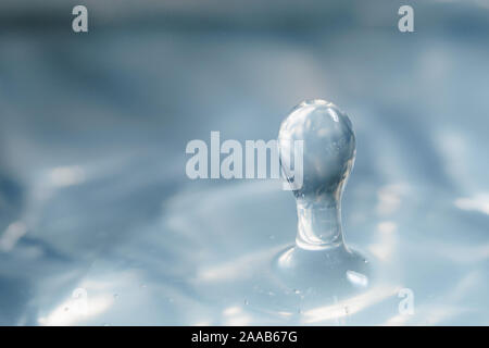 Water drop collision form metallic background Stock Photo