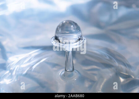 Water drop collision form metallic background Stock Photo
