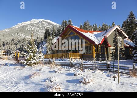 Snowy Cold Mountains With A Wooden Log Cabin Stock Photo 60205231