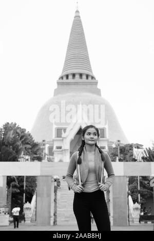 Young beautiful Asian tourist woman exploring Nakhon Pathom province in Thailand Stock Photo
