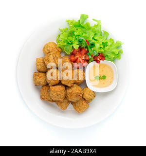 Chicken Rolls deep fried mixed ingredient Asian Food dish Thai style served plum sweet chili sauce decorate carved vegetables and chili carved top vie Stock Photo
