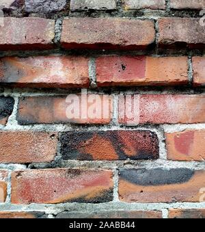 Exterior brick wall made of clinker bricks salvaged from collapsed buildings Stock Photo