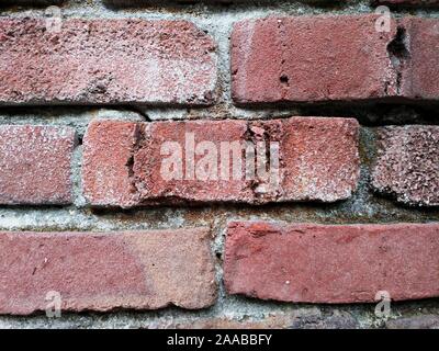 Exterior brick wall made of clinker bricks salvaged from collapsed buildings Stock Photo