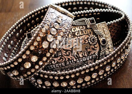 Western Trophy Belt Buckle on rhinestone bling brown belt Stock Photo