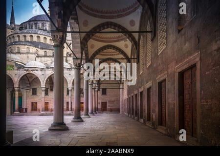 Mosque of Sultanahmet called also the Blue Mosque alley view from inside and outside in Istanbul, Turkey Stock Photo