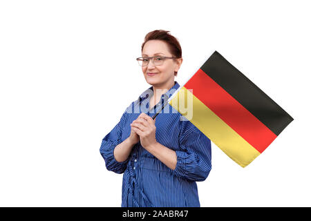 Germany flag. Woman holding Germany flag. Nice portrait of middle aged lady 40 50 years old holding a large flag isolated on white background. Stock Photo