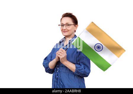 India flag. Woman holding Indian flag. Nice portrait of middle aged lady 40 50 years old holding a large flag isolated on white background. Stock Photo