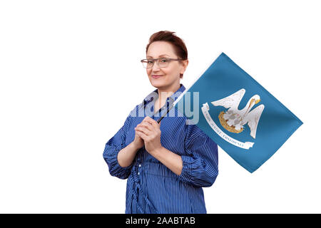 Louisiana flag. Woman holding Louisiana flag. Nice portrait of middle aged lady 40 50 years old holding a large flag isolated on white background. Stock Photo