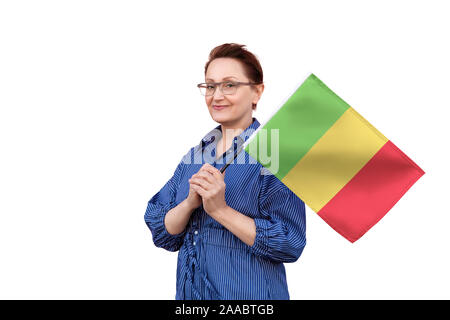 Mali flag. Woman holding Mali flag. Nice portrait of middle aged lady 40 50 years old holding a large flag isolated on white background. Stock Photo