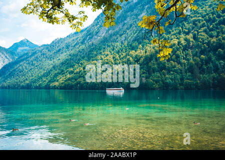 A tourist boat is cruising over the Koenigssee (Königssee) in Bavaria, Germany Stock Photo
