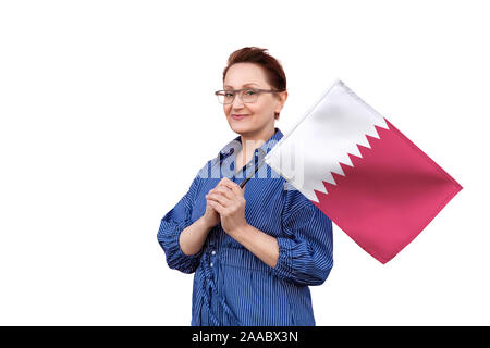 Qatar flag. Woman holding Qatar flag. Nice portrait of middle aged lady 40 50 years old holding a large flag isolated on white background. Stock Photo