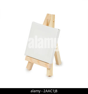 Miniature easel with blank canvas isolated on a white background. Side view Stock Photo