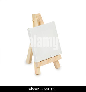 Miniature easel with blank canvas isolated on a white background. Side view Stock Photo