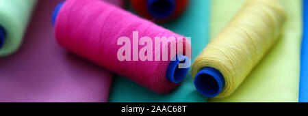 Multicolored threads on coils Stock Photo