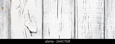 White color timber background, close up view. Painted wooden planks aged by time. Wide angle natural background with great texture, many knots, seams Stock Photo