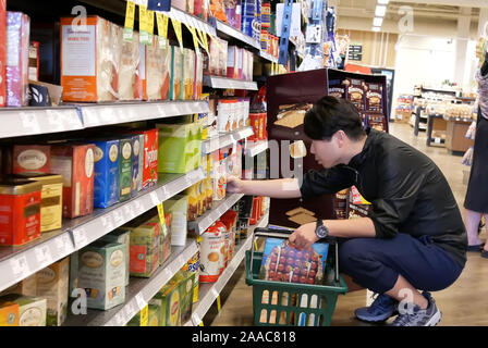 Burnaby, BC, Canada - May 09, 2019 : Motion of people buying cream for coffee inside price smart foods store Stock Photo