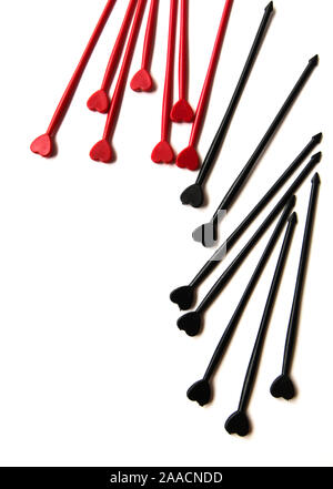 Black and red sticks for canapes on a white isolated background. Decorative chopsticks. Stock Photo