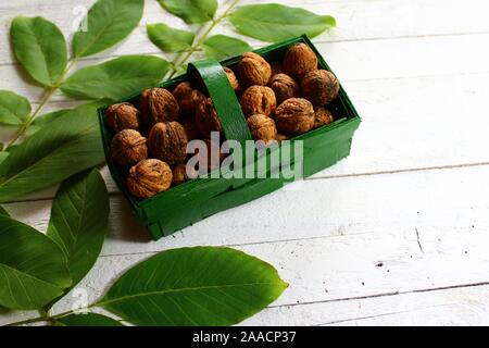 The picture shows walnuts in a basket Stock Photo