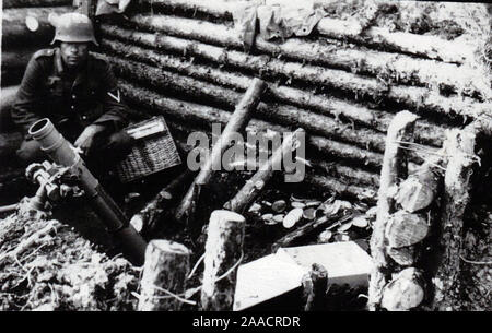 German Soldier in a trench with an 8cm Mortar on the Russian Front 1944. World War Two Private B/W Photo from a former German Soldier Stock Photo