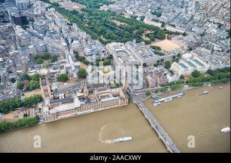 Aerial view of Westminster Palace, Westminster Abbey, Westminster Bridge over River Thames and St James Park from a high vantage point, London, UK Stock Photo