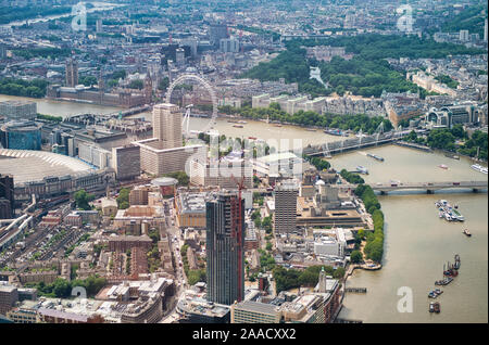 Aerial view of Westminster Palace, Ferris Wheel and city bridges over River Thames from a high vantage point. Stock Photo