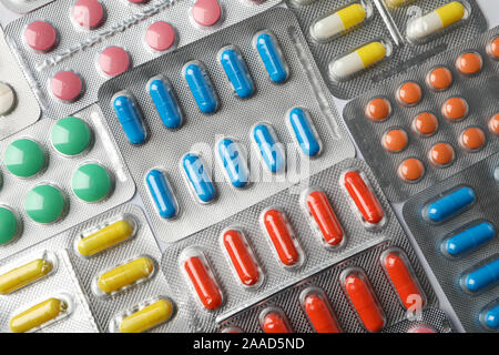 Pills in blister packs textured background, top view Stock Photo